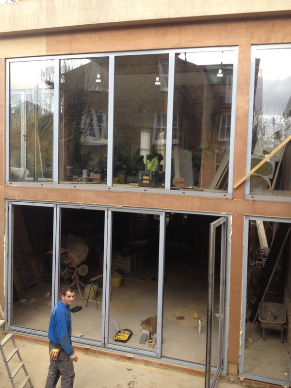 Aluminium bi-fold doors with two-storey glazing in Clapton