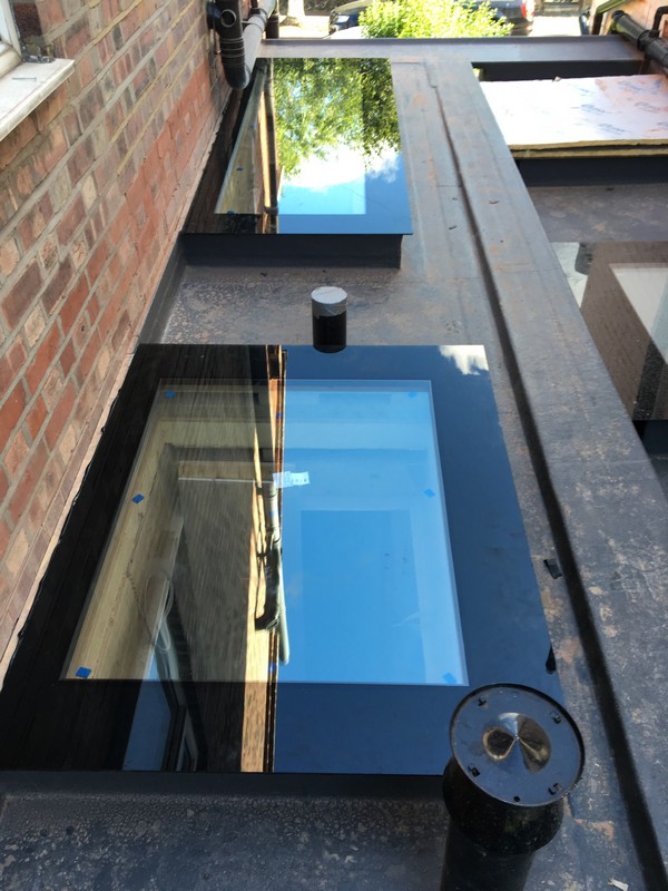Multiple flat roof skylights on extension in Clapton