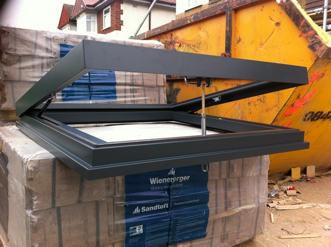 Opening flat roof skylight in anthracite grey installed in Clapton